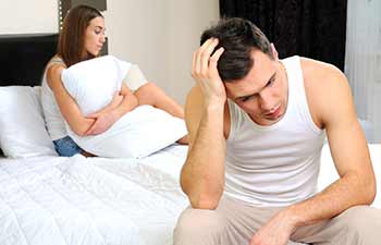 man-with-erectile-dysfunction-on-edge-of-bed